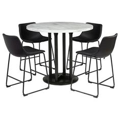 a white table with four black chairs around it and a round marble top on the base