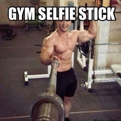 a man with no shirt holding a barbell in his hand and the caption gym selfie stick