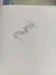 a drawing is shown on top of a piece of paper