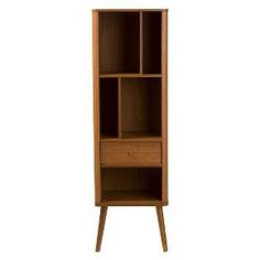 a tall wooden bookcase with drawers on one side and an open drawer on the other