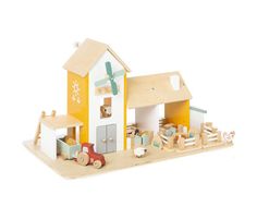 a wooden toy house with cars and trucks