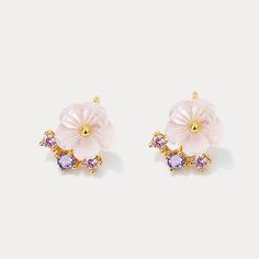 Tired of boring, plain earrings? Spice up your style with our Sakura Flower Stud Earrings! These flower stud earrings will add an adventurous touch to any outfit. Made with delicate Sakura flower designs, they are the perfect blend of beauty and nautre. Sakura blossoms are a beloved symbol of spring, renewal, and fleeting beauty in Japanese culture. Wearing these sakura flower earrings is a way to connect with this cherished tradition and carry a piece of spring with you all year round. These st Delicate Pink Pierced Earrings, Delicate Pink Earrings, Flower Shaped Crystal Earrings, Delicate Pink Flower Earrings For Anniversary, Anniversary Flower Single Earring, Dainty Flower-shaped Pierced Earrings, Plain Earrings, Sakura Blossoms, Brass Shell