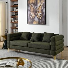 a living room filled with furniture and a painting on the wall