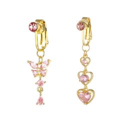 two pairs of gold tone earrings with pink crystals on each side and a heart shaped charm hanging from the bottom