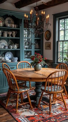 a dining room table with four chairs around it