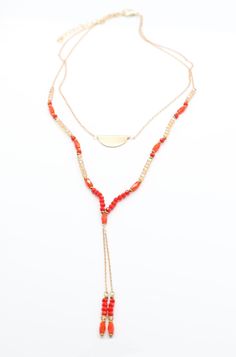 Bring some double the fun to your look with this dual-hued necklace! Featuring a mix of orange and champagne beads, you'll be striking a balance between sassy and chic! Wear with your favorite summer dress for a playful pop of color.Details: Fine Gold Chain Double Strand Necklace Orange and Champagne Colored Beads Length: 16" Extension: 2" Beads: 3mm - 4mm Red Beaded Necklaces For Summer, Summer Red Necklaces With Colorful Beads, Summer Red Necklace With Colorful Beads, Orange Multi-strand Jewelry For The Beach, Orange Multi-strand Jewelry For Beach, Adjustable Orange Multi-strand Necklaces, Orange Multi-strand Beaded Necklaces For Beach, Summer Red Necklace With Beaded Chain, Multi-strand Summer Jewelry For Party