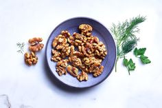 walnuts and parsley on a blue plate