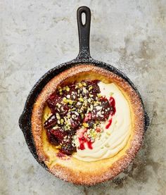 a skillet filled with food on top of a table