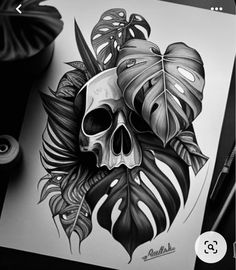 a drawing of a skull with leaves on it