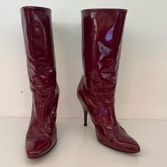 Good Condition, Signs Of Creasing From Wear And Signs Of Wear On The Heel. Crafted From A Burgundy/Red Patent Leather. Size 40 Red Fitted Patent Leather Heeled Boots, Fitted Red Patent Leather Heeled Boots, Elegant Red Patent Leather Boots, Burgundy Fitted Heeled Boots For Party, Burgundy Leather Heeled Boots For Party, Party Leather Boots In Burgundy, Burgundy Pointed Toe Heeled Boots For Formal Occasions, Party Burgundy Leather Boots, Elegant Burgundy Party Boots