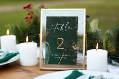 a table setting with candles and place cards