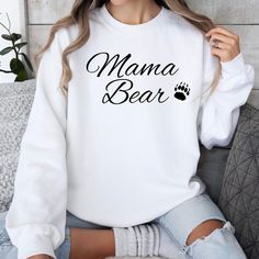 Mama Bear Sweatshirt, a Cozy Sweater for Mom, 3 Colors: Sand, White and Gray, Aesthetic Mama Shirt, Crewneck Sweatshirt for colder months. Ideal for any situation, a unisex heavy blend crewneck sweatshirt is pure comfort. These garments are made from polyester and cotton. This combination helps designs come out looking fresh and beautiful. The collar is ribbed knit, so it retains its shape even after washing. There are no itchy side seams on these sweaters. .: Made with a medium-heavy fabric ble White Comfortable Winter Sweatshirt, White Letter Print Cozy Top, Cozy White Tops With Letter Print, Cozy White Cotton T-shirt, Trendy White Cozy Fit Top, White Comfortable Fit T-shirt For Winter, White Letter Print Cozy Fit Top, White Cozy Fit Tops With Letter Print, White Cozy Fit Top With Letter Print