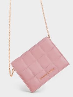 We are absolutely in love with our quilted mini wallet. From its elegant quilted finish to its gorgeous shade of blush pink, this is the must-have accessory you need. Bonus points for the detachable chain strap that offers multiple ways of wear. Whether you choose to use this pretty piece as a wallet or a micro bag, one thing's for sure — you are bound to look impeccably stylish. Pink Bags, Micro Bag, Short Wallet, Shop Shoes, Charles Keith, Mini Short, Mini Wallet, Fit Check, Pink Bag