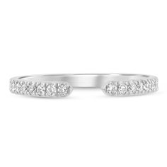 a white gold wedding band with five diamonds on the top and side stones in the middle