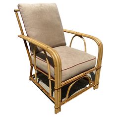 a chair that is made out of bamboo and has a cushion on top of it