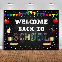 a welcome back to school sign on a blackboard in an empty room with wooden floors