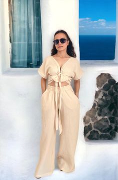 Beige Summer Cotton Sets, Beige Cotton Summer Sets, Beige Cotton Sets For The Beach, Beige Cotton Beach Set, Casual Beige Pant Set For Spring, Summer Beige Pant Set, Beige V-neck Summer Sets, Summer Two-piece Loungewear Pant Set, Chic Linen Sets For Beach