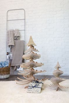 a wooden christmas tree sitting on top of a white rug