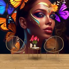 a woman with butterflies painted on her face and two chairs in front of the wall