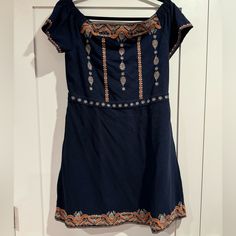 Navy With Pewter And Orange Embroidery Detail Across Front Back Neckline,Hem, And Waist. Above The Knee Style Cap Sleeve. Orange Embroidery, Tory Burch Dress, Embroidery Details, Large Size Dresses, Above The Knee, Cap Sleeve, The Knee, Cap Sleeves, Tory Burch