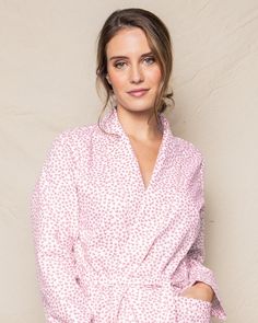 Like joyful confetti, the little pink hearts dance across the fabric as if batting their eyelashes. This elegant robe is the perfect addition to our collection. The classic, fun print is a staple and will have you looking smart in no time. The fabric is made from 100% of the finest quality cotton. It is yarn-dyed to prevent fade and brushed for added softness making the sleepwear feel absolutely luxurious, getting cozier after each wash. You will be tucked in luxury and off to dreamland. Bonne n Pink Long Sleeve Sleepwear With Heart Print, Fitted Pink Printed Sleepwear, Pink Robe For Spring Sleepwear, Pink Robe For Sleep And Spring Season, Spring Floral Print Fitted Robe, Pink Heart Print Sleepwear For Summer, Spring Heart Print Sleepwear For Sleepover, Pink Feminine Robe For Spring, Fitted Floral Print Spring Robe