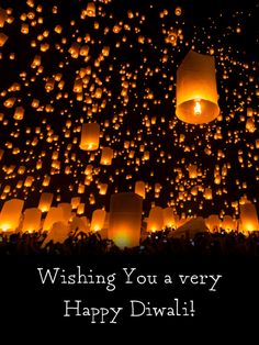 the sky is filled with many lit lanterns and there are words written on it that read wishing you a very happy diwal