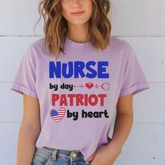 a woman wearing a purple shirt with the words nurse by day, patriotic by heart