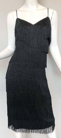 For Sale on 1stDibs - Fabulous mid 1970s does 1920s LILLI DIAMOND black fully fringed flapper style jersey cocktail dress! Words cannot even begin to describe how utterly gorgeous Vintage Fringe Flapper Dress, Fitted Flapper Dress With Tassels For Cocktail, Fitted Flapper Dress With Tassels For Evening, Fitted Tassel Flapper Dress For Evening, Fitted Fringe Flapper Dress For Cocktail, Fitted Cocktail Flapper Dress With Fringe, Sleeveless Fringe Flapper Dress For Evening, Black Gatsby Style Fringe Dresses, Black Gatsby Style Dresses With Fringe