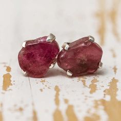 These handmade stud earrings hold rough gemstones in a sleek silver setting. A wonderful gift for a birthday, anniversary or just to show some love. A variety of genuine, rough stone options are available, including many birthstones! View our complete birthstone jewelry collection to find other items. In-stock and ships in 1-3 business days! EARRING DETAILSMetal: Sterling SilverFinish: PolishedSize: 7-10 mm DiameterStyle: Stud, Push Back GEMSTONE* OPTIONS:AmethystAquamarineCitrineEmeraldGarnetHe Stud Earrings Unique, Amethyst Studs, Stud Jewelry, Rough Gemstone, October Birth Stone, Birthstone Jewelry, Birthday Anniversary, Last Minute Gifts, Love A