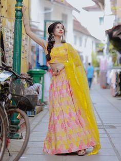 This exquisite ensemble features a yellow color organza lehenga adorned with digital print work, sequins, and thread embroidery work, creating a contemporary and elegant look. The similar color slub silk choli is embellished with sequins, thread embroidery work, and mirror work, adding a touch of glamour to the outfit. Completing the look is a similar color organza dupatta with sequins and thread embroidered work, along with a designer lace borderwork for a stylish finish.
The semi-stitched lehe Yellow Tissue Silk Sharara For Eid, Yellow Tissue Silk Salwar Kameez For Navratri, Navratri Yellow Tissue Silk Salwar Kameez, Yellow Anarkali Set With Resham Embroidery In Tissue Silk, Yellow Tissue Silk Anarkali Set, Yellow Tissue Silk Anarkali Set For Diwali, Yellow Tissue Silk Salwar Kameez For Eid, Semi-stitched Yellow Choli With Gota Work, Yellow Organza Dress For Navratri