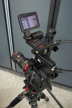 a video camera sitting on top of a tripod