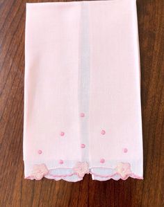 Darling little pink linen-cotton hand-sewn small tea towel!  Dark rose pink polka dots are embroidered above three appliqued pink flowers. Between the three flowers are insets of white gauze delicately sewn in. The bottom edge is scalloped. This is a smaller towel, measuring 17 inches by 11 inches, meaning it is known as a fingertip or guest towel.  Flawless vintage. Fine handwork. No label. So cute! All the towels I have listed I have cleaned, dried in open air, pressed, and carefully inspected. These are mostly vintage or antique towels, often handmade and hand-embroidered. They are usually linen, though sometimes a combination of linen and cotton, and usually unmarked by a label.  I also can list high quality labelled towels.   Each towel is unique.  Perfect gift! Pink Embroidered Cotton Handkerchiefs, Pink Cotton Handkerchief For Spring, Three Flowers, Dark Rose, Small Towel, Guest Towel, Pink Linen, No Label, Guest Towels