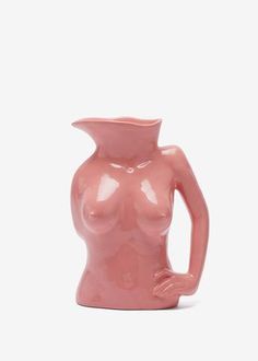 a pink ceramic vase with a woman's torso on the front and side, against a white background