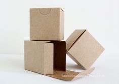 three cardboard boxes stacked on top of each other with one open box in the middle