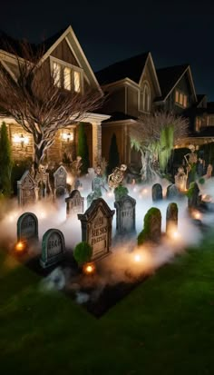 a spooky graveyard in front of a house at night with fog coming from the ground