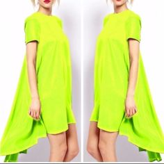 A Beautiful And Classic High Low Tee Shirt Dress Featuring Cool, Flowy Fabric And Two Pleats In Back To Create A Greater Flow! Great For Day Or Night Wear With Heels Or Flats. Layer Up With Sweaters And Jackets Or Bold Jewels For A Night Out Of Town! 95% Polyester 5% Spandex Green Stretch Mini Dress With Short Sleeves, Summer Stretch Dress With Crew Neck, Green Shift Mini Dress With Short Sleeves, Summer Crew Neck Stretch Dress, Summer Stretch Crew Neck Dress, Trendy Green Short Sleeve Dress, Green Short Sleeve T-shirt Dress For Spring, Summer Stretch Mini Dress With Crew Neck, Yellow Short Sleeve Mini Dress