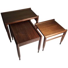 three wooden tables sitting on top of each other