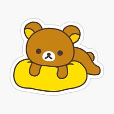 a brown teddy bear sitting on top of a yellow pillow sticker with the words, i