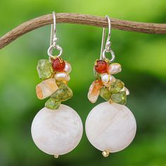 Expressed in gemstones, joyous colors cluster in exquisitely feminine earrings. Nareerat knots iridescent quartz, vibrant red-orange carnelian, and green peridot with glass beads on silken strands to hang from silver wires. Ad Earrings, Surrealist Art, Feminine Earrings, Pearl Cluster, Green Peridot, Pearl Earrings Dangle, Cluster Earrings, Pink Quartz, Jewelry Packaging