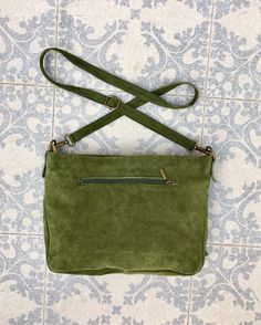 Boho bag in GREEN SUEDE. Genuine leather CROSSBODY bag in GREEN with zippers and adjustable strap. Natural suede leather in GREEN. Cross over or shoulder bag. The color of the bag corresponds to the 2 first pictures, it is not as light as on the 3rd picture. The inside of the bag is fully lined in a strong nylon-cotton mix fabric . It has a main zipper on its upper part and one extra zipper closed pocket at each side of the bag aswell. Adjustable suede straps. Width upper part: 30 cm - 12 inch H Green Soft Leather Crossbody Satchel, Green Leather Handled Crossbody Hobo Bag, Green Leather Handle Crossbody Hobo Bag, Green Suede Bags For Everyday Use, Green Suede Shoulder Bag For Everyday Use, Natural Leather Bag, Bag With Tassel, Guitar Bag, Slouch Bags