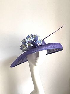 Violet disc hat Violet hat made of sinamay base attached to the rubber band. On the side is sitting matching hydrangea and a feather.  The hat is very elegant. The hat will be an amazing accessory to compliment your outfit at the Royal Ascot races, Kentucky Derby races, Wedding or a Garden party. The hat will fit an average head size. Enjoy your special day with this beautiful headpiece! Luxury Purple Mini Hat For Royal Ascot, Summer Wide Brim Purple Costume Hat, Summer Purple Wide Brim Costume Hat, Purple Mini Hats With Short Brim For Races, Purple Mini Hats For Church And Kentucky Derby, Purple Wide Brim Summer Costume Hat, Adjustable Purple Costume Hats And Headpieces For Church, Purple Brimmed Mini Hat For Church, Adjustable Purple Costume Hat For Summer