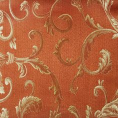 an orange and gold wallpaper with floral designs on it's side, in the background