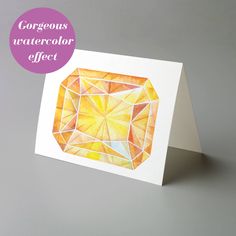 a greeting card with an orange diamond on the front and bottom, which reads gorgeous watercolor effect effect