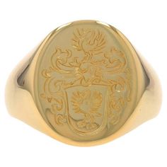 Size: 8 3/4 Sizing Fee: Up 3 sizes for $100 or Down 2 sizes for $50 Metal Content: 18k Yellow Gold Style: Signet Theme: Crest, Coat of Arms Measurements Face Height (north to south): 11/16" (17.2mm) Rise Above Finger: 1/8" (2.4mm) Weight: 15.2 Grams Stamps: 750, LPC Condition: Pre-Owned Professionally cleaned, polished, and tested to guarantee metal content. La Face, Gold Style, Coat Of Arms, Signet Ring, Onyx, Ring, Metallica, Rings For Men, Jewelry Rings