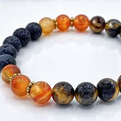 Mala Bracelet, Mens Bracelet, Womens Bracelet - Tiger Eye, Carnelian, Lava Stone . Wear your essential oil in style with these aromatherapy beaded bracelets. Each bracelet will contain either natural wood or lava stone to hold the essential oil.  . . Tiger Eye: strengthens willpower, confidence, protection, courage . Carnelian: anchoring the present, restore lost vitality and motivation, improves concentration . . How do I diffuse?  Place one or two drops of essential oils in your palm, roll the Orange Agate Gemstone Bracelets, Orange Natural Stone Bracelets As Gift, Orange Natural Stone Bracelet For Gift, Orange Bracelets With Natural Stones For Gifts, Orange Spiritual Gemstone Bracelets, Spiritual Orange Gemstone Bracelets, Orange Bracelets With 8mm Round Beads, Orange Hand-strung Spiritual Bracelets, Spiritual Orange Hand-strung Bracelets