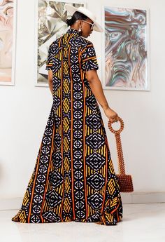 PRODUCT DETAILS: Designed in the U.S., hand-crafted in Africa Delivery within 2 weeks Multiple prints available This sophisticated unlined kaftan dress is designed with traditional African ankara fabric shown in yellow and black. The buttoned front style is perfect for making a grand impression! Can be worn as evening wear to various events such as weddings, dinner parties and other formal occasions. CUSTOM: You pick your fabric and style @ Custom Clothes. FABRIC CARE: Dry Clean. Hand Wash. Mach Traditional Batik Print Short Sleeve Maxi Dress, Traditional Batik Print Maxi Dress With Short Sleeves, Traditional Black Printed Kaftan, Yellow Printed Long Maxi Dress, Yellow Long Printed Maxi Dress, Traditional Yellow Long Maxi Dress, Traditional Yellow Maxi Kaftan, Traditional Yellow Maxi Length Kaftan, Black Printed Short Sleeve Kaftan