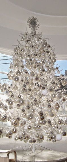 a christmas tree made out of glass balls