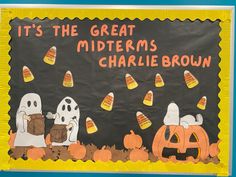 a bulletin board with candy corn and ghost