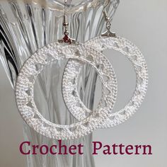 two pairs of hoop earrings are shown in front of a clear vase with the words crochet pattern on it