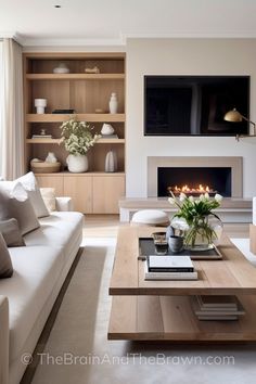 a living room filled with furniture and a fire place